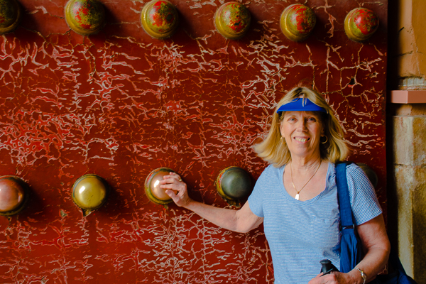 Rebecca rubbing ball for luck in the Forbidden City, Beijing.
