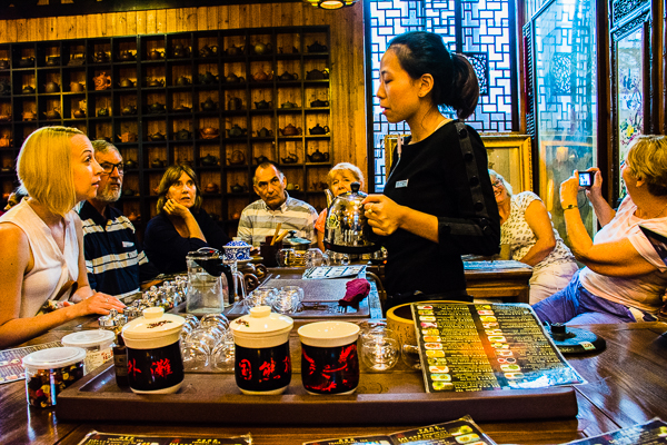 Learning about and sampling Chinese teas in the Tea House in Shanghai.